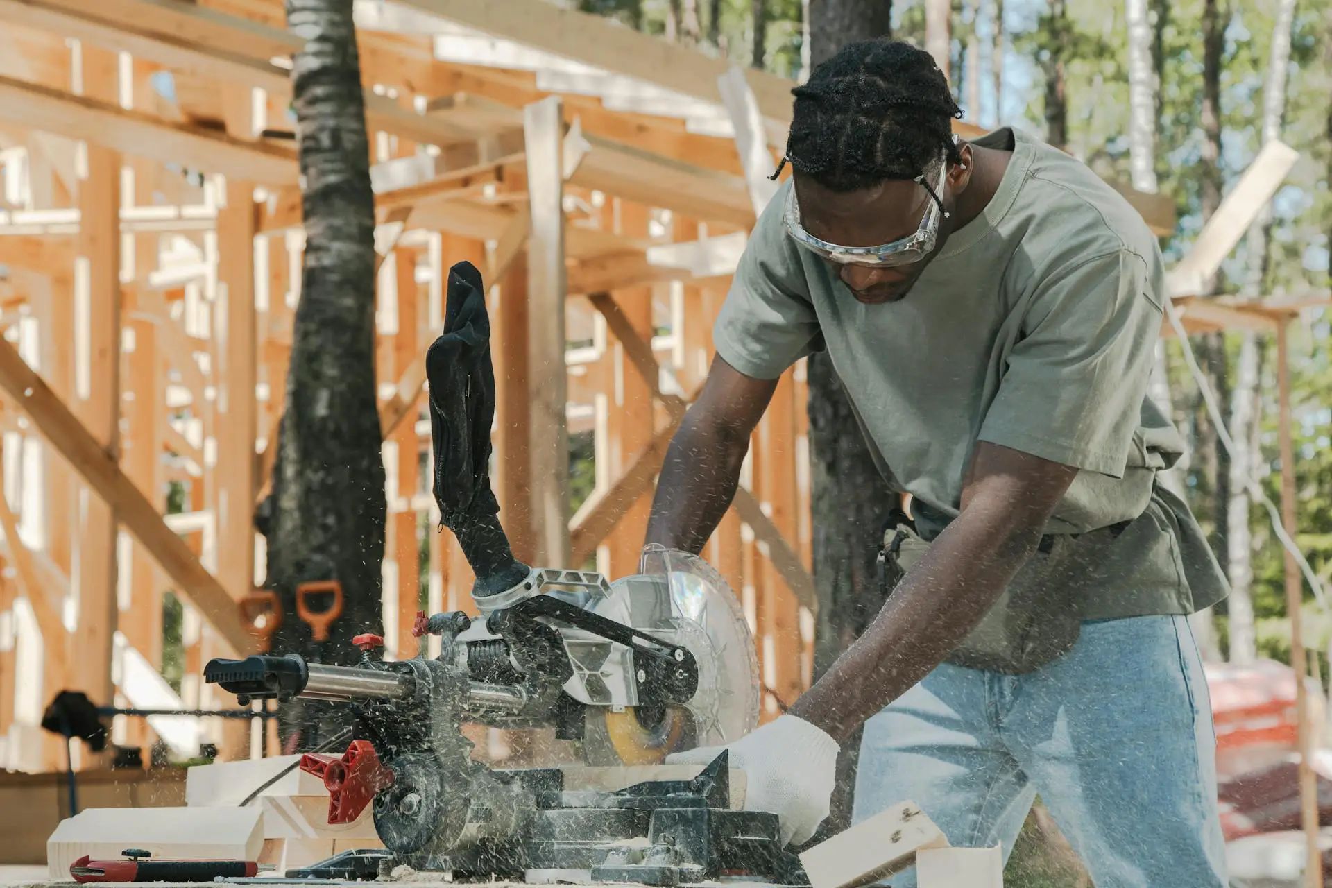 Picture of a man working on wood, possibly a contractor